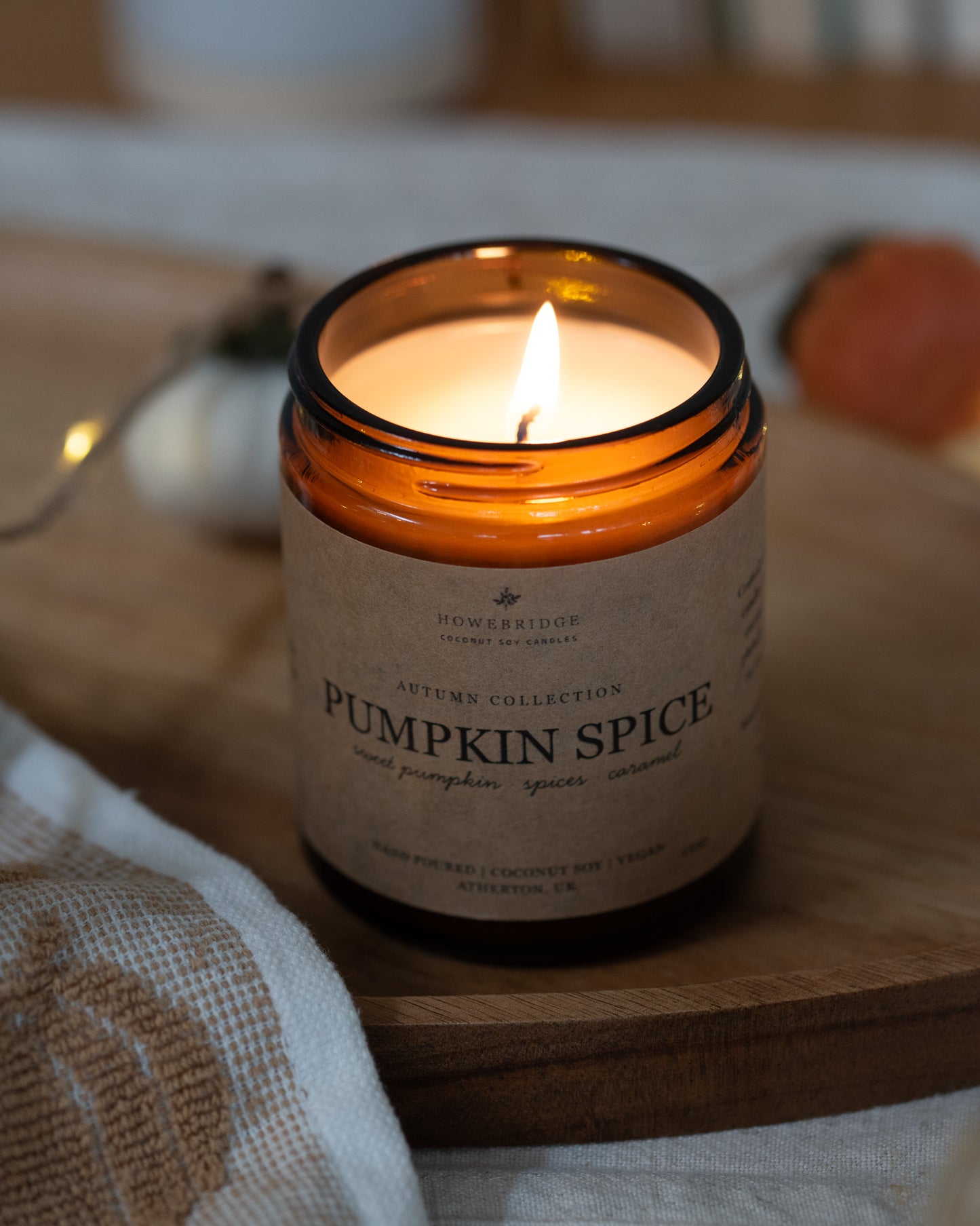 Pumpkin Spice autumnal candle. Kraft brown label on a lass amber jar. Cosy and hand crafted. Hand poured with coconut soy wax and toxin free fragrances in Howe Bridge.