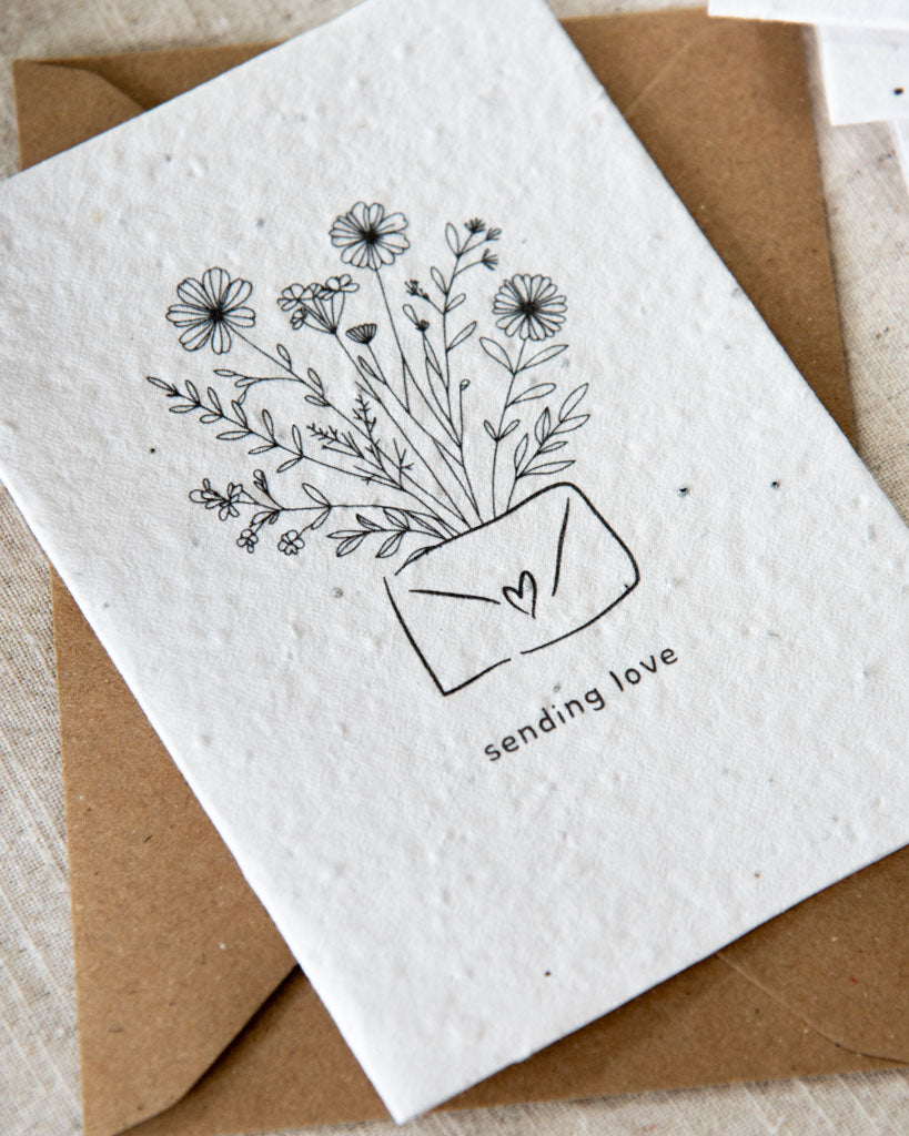 Wildflower plantable seed card with the message 'sending love'. Personalise for the ultimate gift. Printed on cotton paper with bee-friendly seeds inside. Sustainable and eco-friendly.