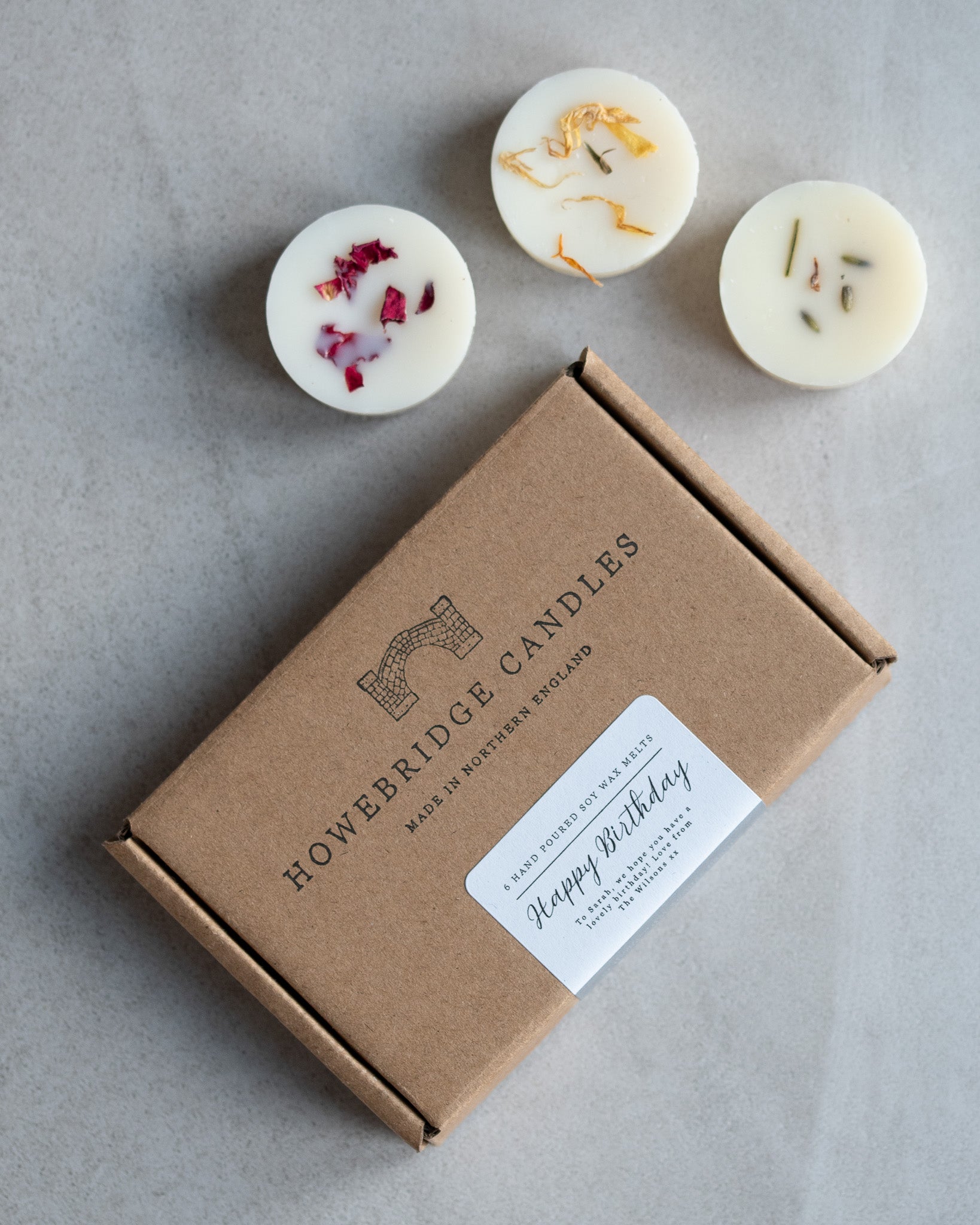 Howebridge Candles soy wax melt letter box gift. Stamped with their logo and sealed with a personalised happy birthday message. Surrounded by 3 wax melts sprinkled with dried botanicals.