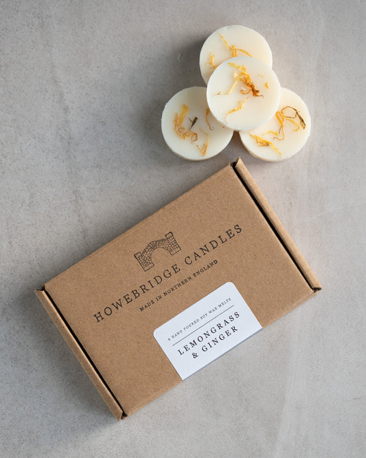 Howebridge Candles lemongrass and ginger wax melts. 6 round botanical wax melts inside a kraft box, labeled with their logo and scent label.