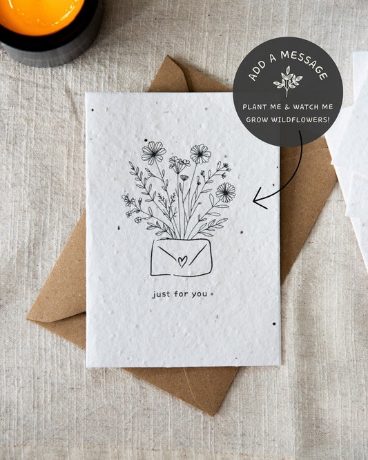 Wildflower plantable seed card with the message 'just for you' surrounded by botanicals. Printed on 100% cotton paper and complete with C6 Kraft envelope. Sustainable and eco-friendly gift.