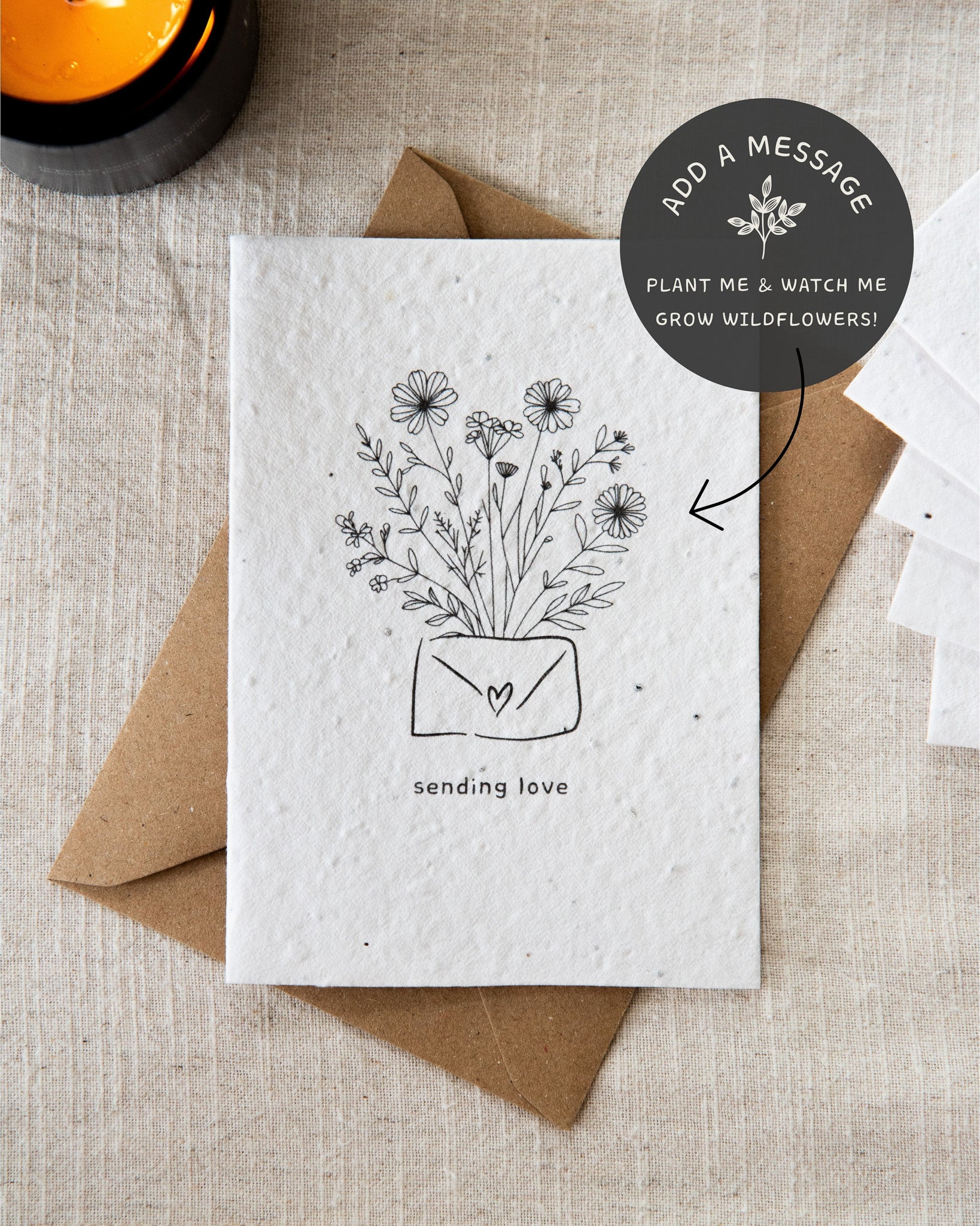Wildflower plantable seed card with the message 'sending love' surrounded by botanicals. Printed on 100% cotton paper and complete with c6 kraft envelope. Sustainable and eco-friendly. Can be personalised.